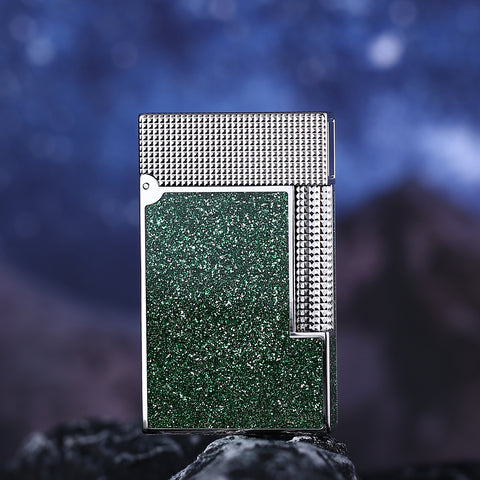 Green textured lighter with metallic frame on a dark background